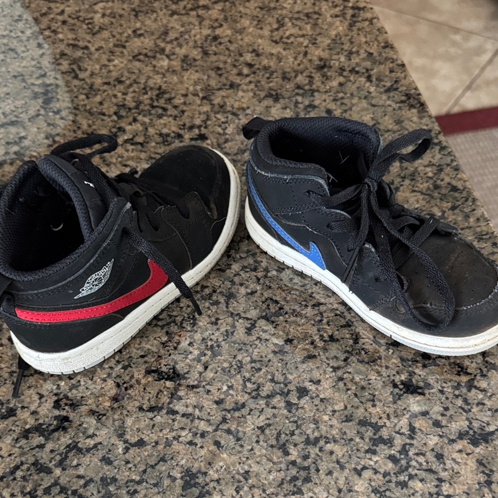 Nike Kids Black Sneakers with Red and Blue Accents
